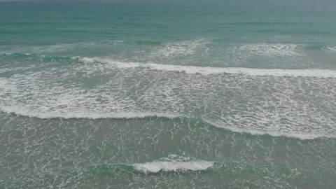 Flying camera flies over a beautiful beach overlooking the waves Stock Footage 116119838