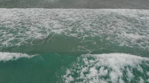 Flying camera flies over a beautiful beach overlooking the waves Video stock 116119879