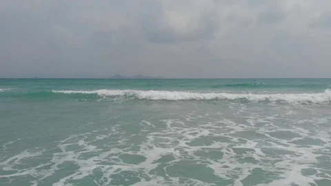 Flying camera flies over a beautiful beach overlooking the waves, Vietnam Stock Footage 116120180