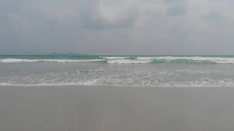 Flying camera flies over a beautiful beach overlooking the waves, Vietnam Stock Footage 116120311