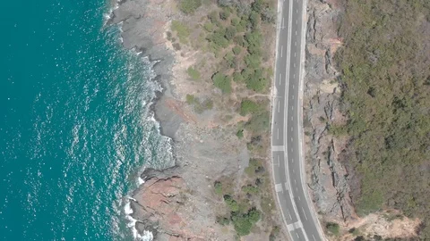 A flying camera flies over a beautiful rocky sea shore overlooking Video stock 118283849