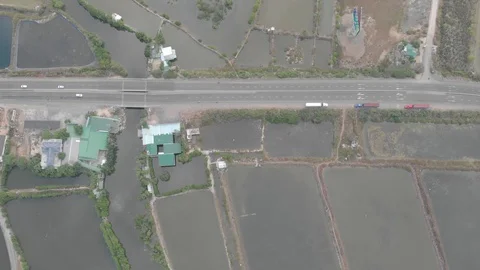 A flying camera flies over the fields that are flooded with water 스톡 동영상 117433014