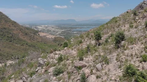 A flying camera flies over the jungles and mountains of Vietnam Stock Footage 117445074