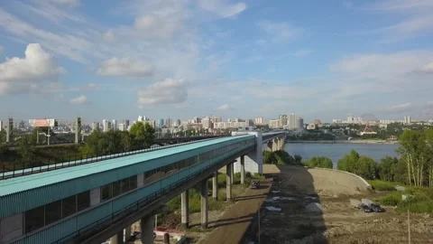Flying camera flies over the metro bridge and the road bridge in Novosibirsk Stock Footage 139036130