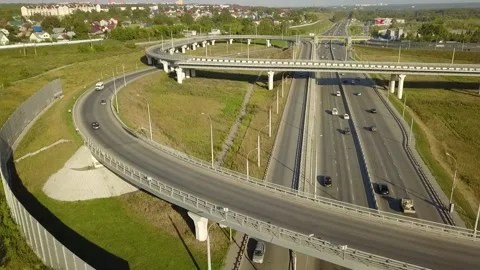 A flying camera monitors the car moving along the overpass Video stock 141501101