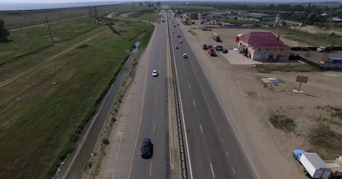 Flying camera is moving over the highway Stock Footage 56349576