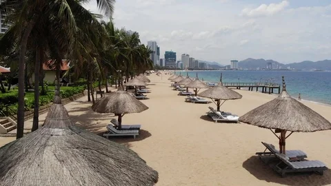 A flying camera over the beach of Nha Trang Vietnam sea island of palm trees Video stock 100187501