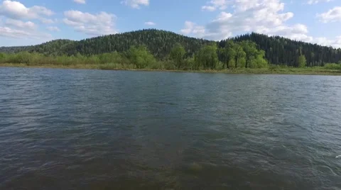 Flying camera over the river island in the direction of the mountains Stock Footage 67109904