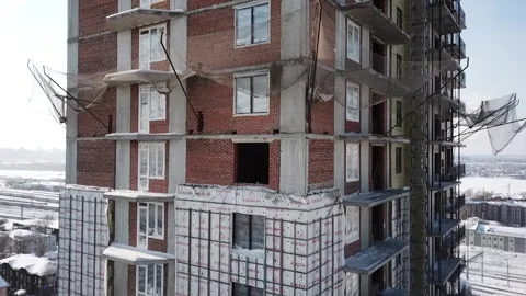 Flying camera shows the construction of a high-rise building Stock Footage 162165152
