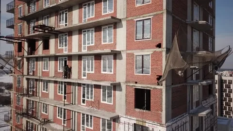 Flying camera shows the construction of a high-rise building Stock Footage 162165248