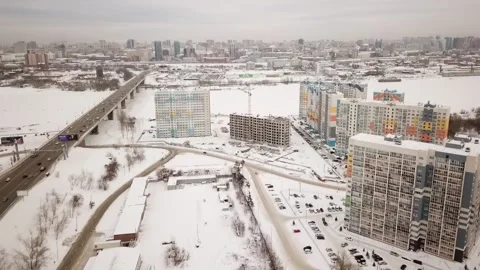 The flying camera shows from a height 2 new residential areas near the river Stock Footage 147005431
