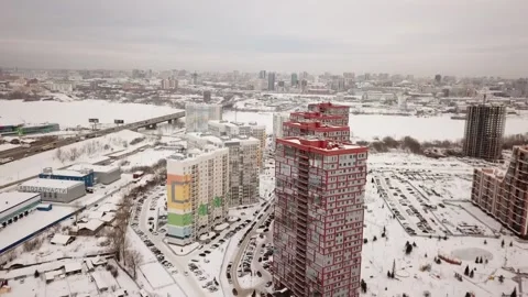 The flying camera shows from a height 2 new residential areas near the river 스톡 동영상 147005433