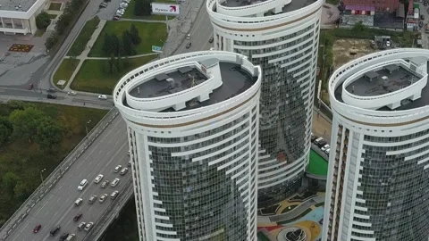 A flying camera shows the windows of a white skyscraper in Russia Stock Footage 139564398