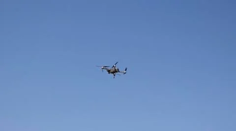 A flying camera in the sky. Stock Photos