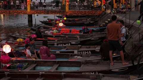A flying camera takes pictures of luminous boats that sail along the river. Stock Footage 128277377