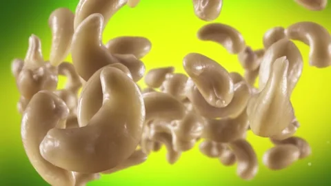 Flying of Cashews in Lime Green Background Stock Footage 146261286