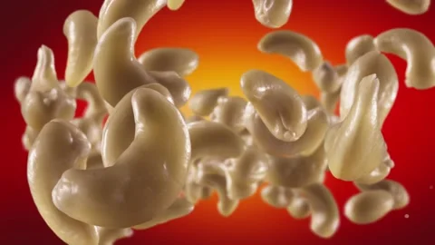 Flying of Cashews in Red Background Stock Footage 146261897