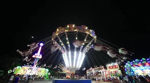 Flying Chairs at Amusement Park Stock Footage 65368993