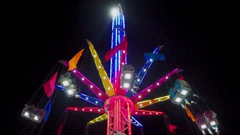 Flying chairs ascending to their maximum height Stock Footage 295458002