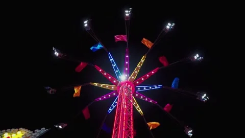Flying chairs at night at their maximum height Stock Footage 295458001