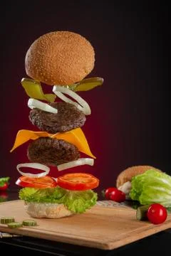 Flying cheese burger Stock Photos