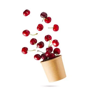 Flying cherries vertical isolated as package design elements. Fresh raw cheery Stock Photos