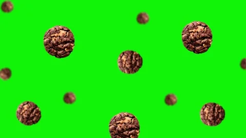 Flying chocolate cookie of different diameters on the green screen background Stock Footage 166412280