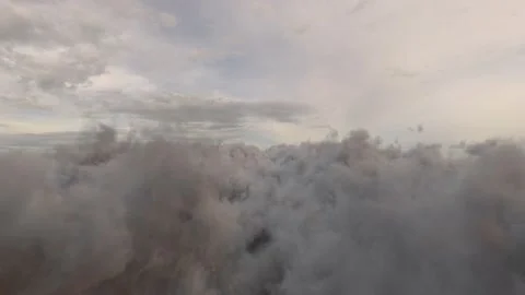 Flying in the Cinematic Grey Clouds Stock Footage 165171823