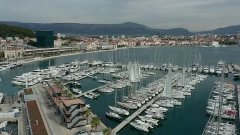Flying clockwise over marina in bay of Split Croatia Stock Footage 142214534