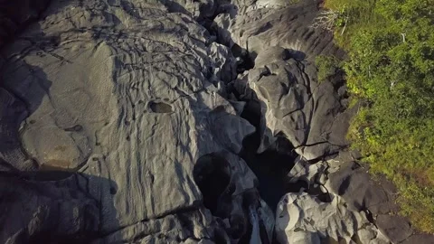 Flying close to the ground revealing unique rock formations in Vale da Lua Video stock 301774257