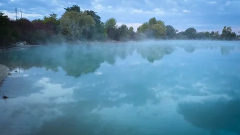 Flying close to the lake surface on a bright autumn morning. Stock Footage 98347447