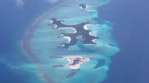 Flying close over tropical sandy islands, Indian Ocean, Maldives Stock Footage 87616561