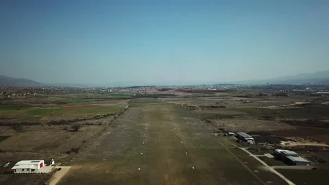 Flying close to the runway and goes back up in the air, Stenkovec Airfield Stock Footage 141995616