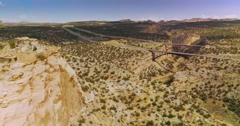 Flying close to the top of the rock in desert.  Stock Footage 213345337