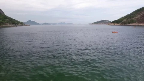 Flying close to the water between mountains. Stock Footage 81138309