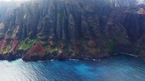Flying by Cloud topped Rugged Coast of Kauai Stock Footage 138401185