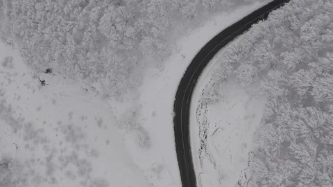 Flying in the clouds above snowy mountain, Georgia (country) Video stock 124929956