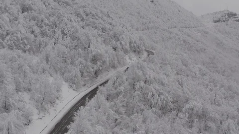 Flying in the clouds above snowy mountain, Georgia (country) Video stock 124930688