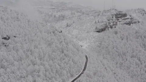 Flying in the clouds above snowy mountain, Georgia (country) 動画素材 124935800