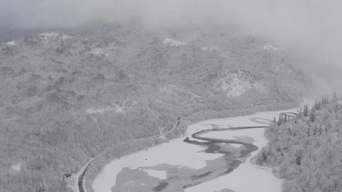 Flying in the clouds above snowy mountain, Georgia (country) Video stock 124937771