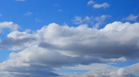 Flying clouds against the blue sky Stock Footage 47924479