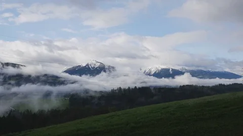 Flying clouds at Alps mountains timelapse Video stock 74670908