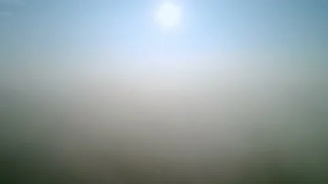 Flying in the clouds and climbing above them. Bright sun and clear sky. Stock Footage 211759258