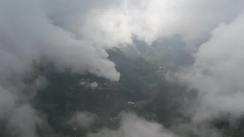 Flying in clouds and fog in a rain forest on a tropical mountain island 库存影片 243715635