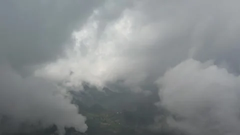 Flying in clouds and fog in a rain forest on a tropical mountain island 库存影片 243715662
