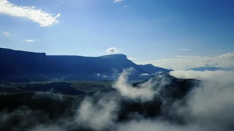 Flying in clouds and panning down  스톡 동영상 87621854