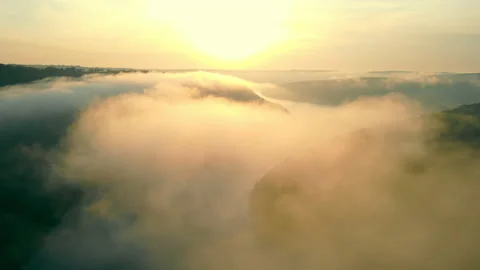 Flying in the clouds and rays of the morning sun. Movement over the clouds Stock Footage 163885948