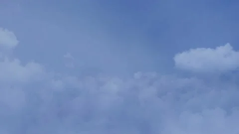 Flying in the clouds, camera movement through the clouds, video loop Video stock 100115879