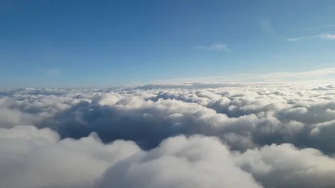 Flying on the clouds, day above weather bright sunny blue sky top Stock Footage