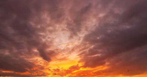 Flying clouds orange at sunset Stock Footage 138440504
